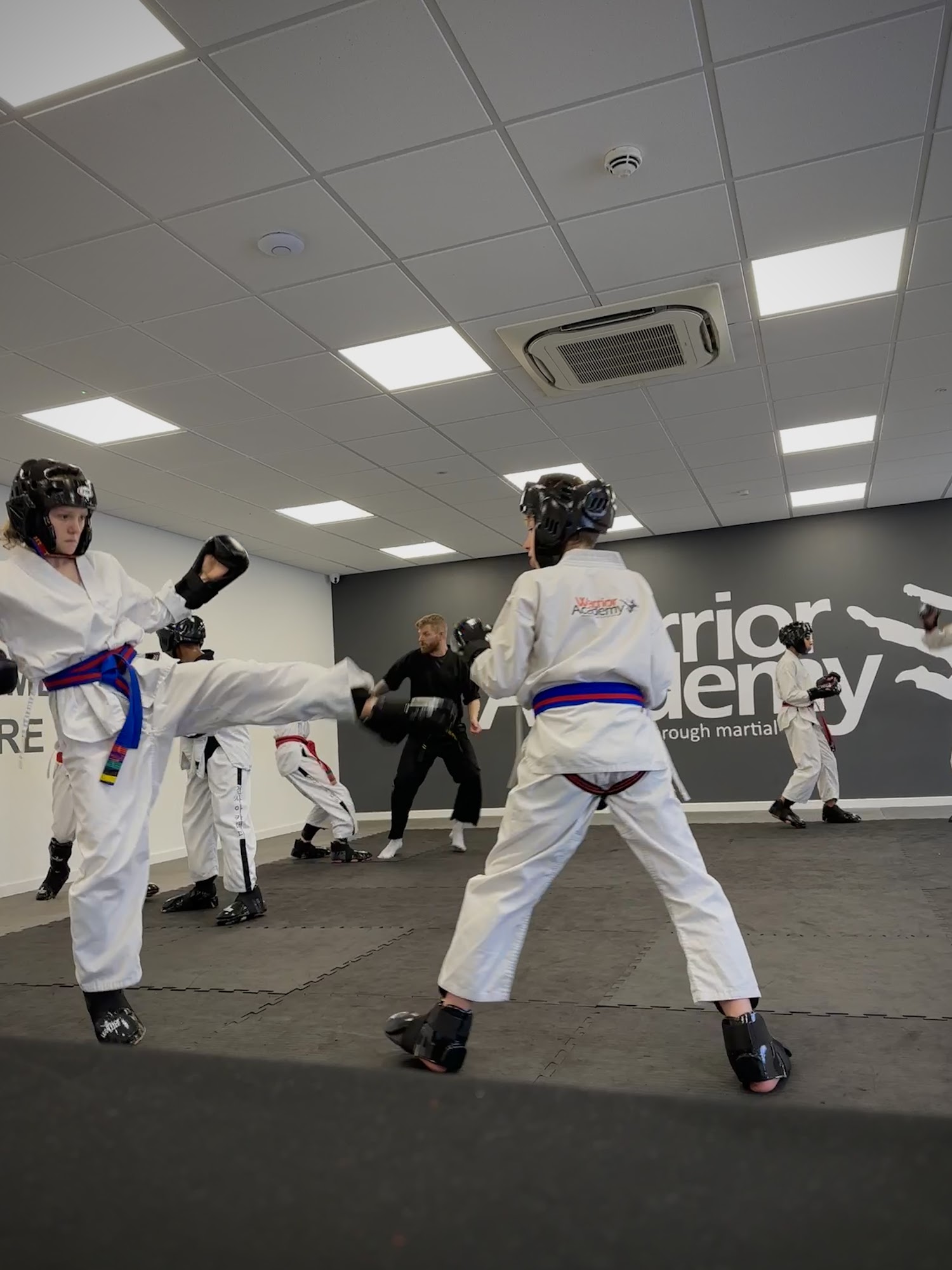 Students sparring in headgear at our Character Development Centre