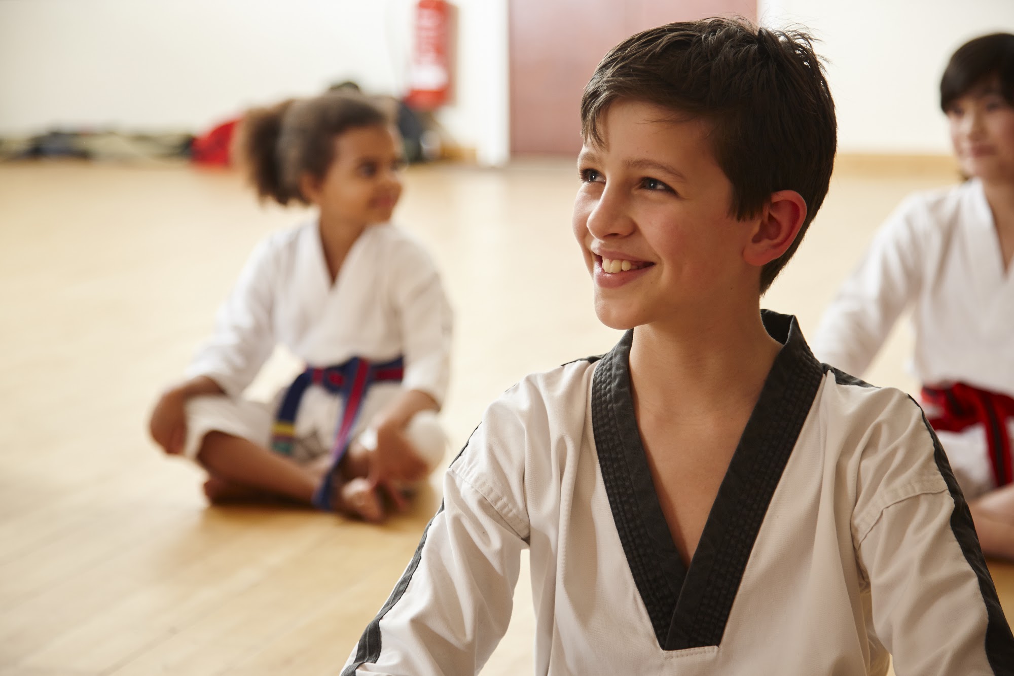 A student smiling in class at Rode